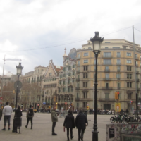 A view of the street in Barcelona, with Casa Battlo in the backgroud.